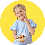 girl scratching her neck while holding bowl of nuts